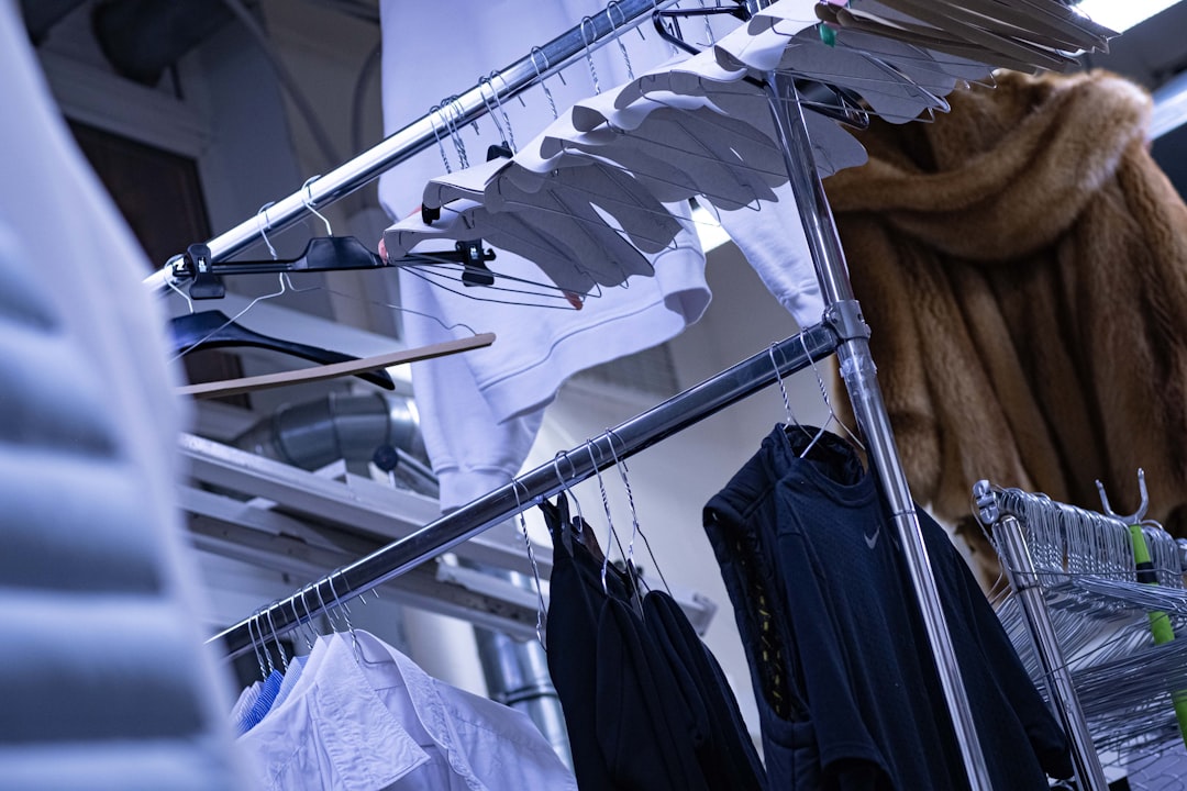a-clothes-rack-with-clothes-hanging-on-it-ouuy9qmpwze